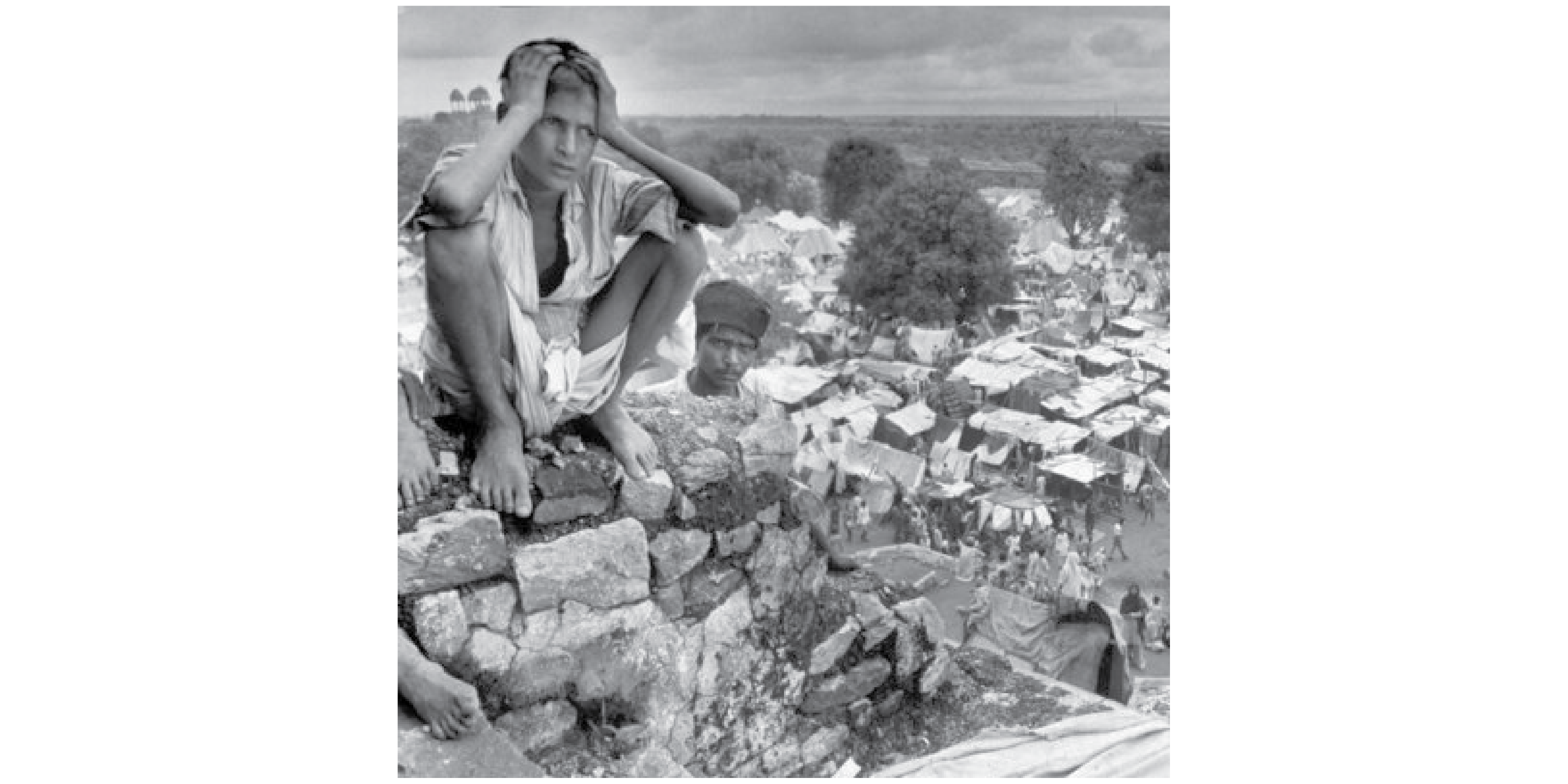 A youth sits on a wall overlooking thousands of dispossessed people and their shelters.