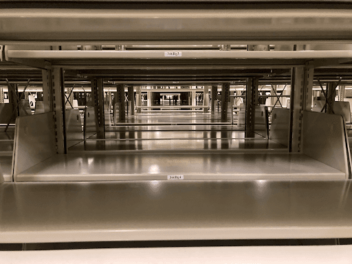A view through empty shelving.
