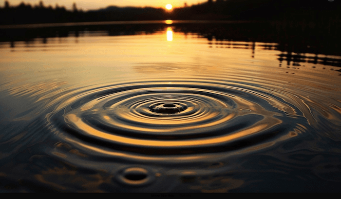 A silhouette of land with cloud-strewn skies above and water below. The water has a wave rippling out from the center.