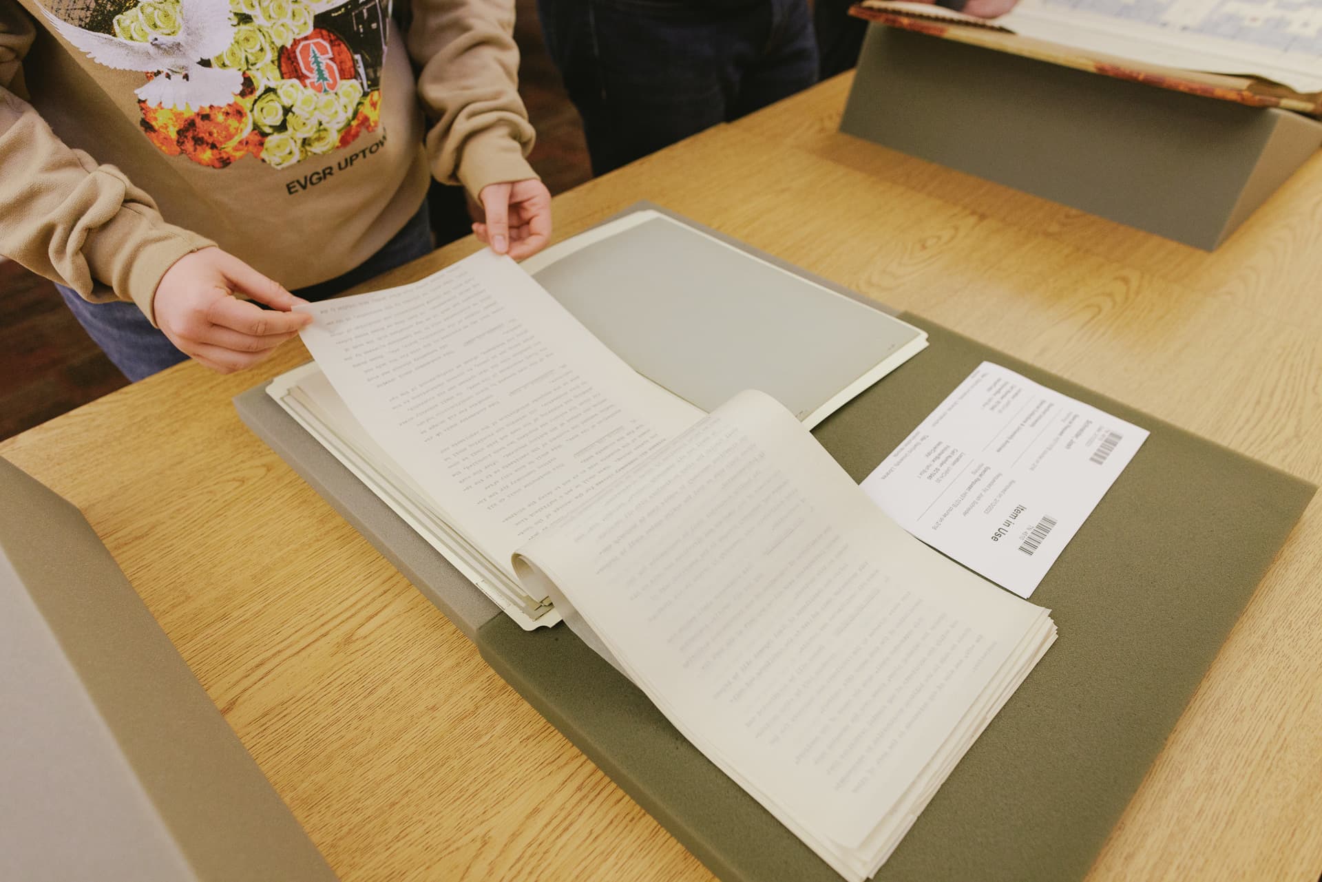 Students use archival material during workshop in Special Collections classroom