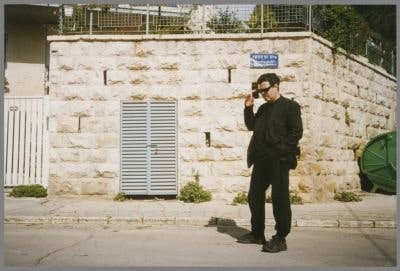 The image depicts the filming of Amos Gitai's documentary, A House in Jerusalem.
